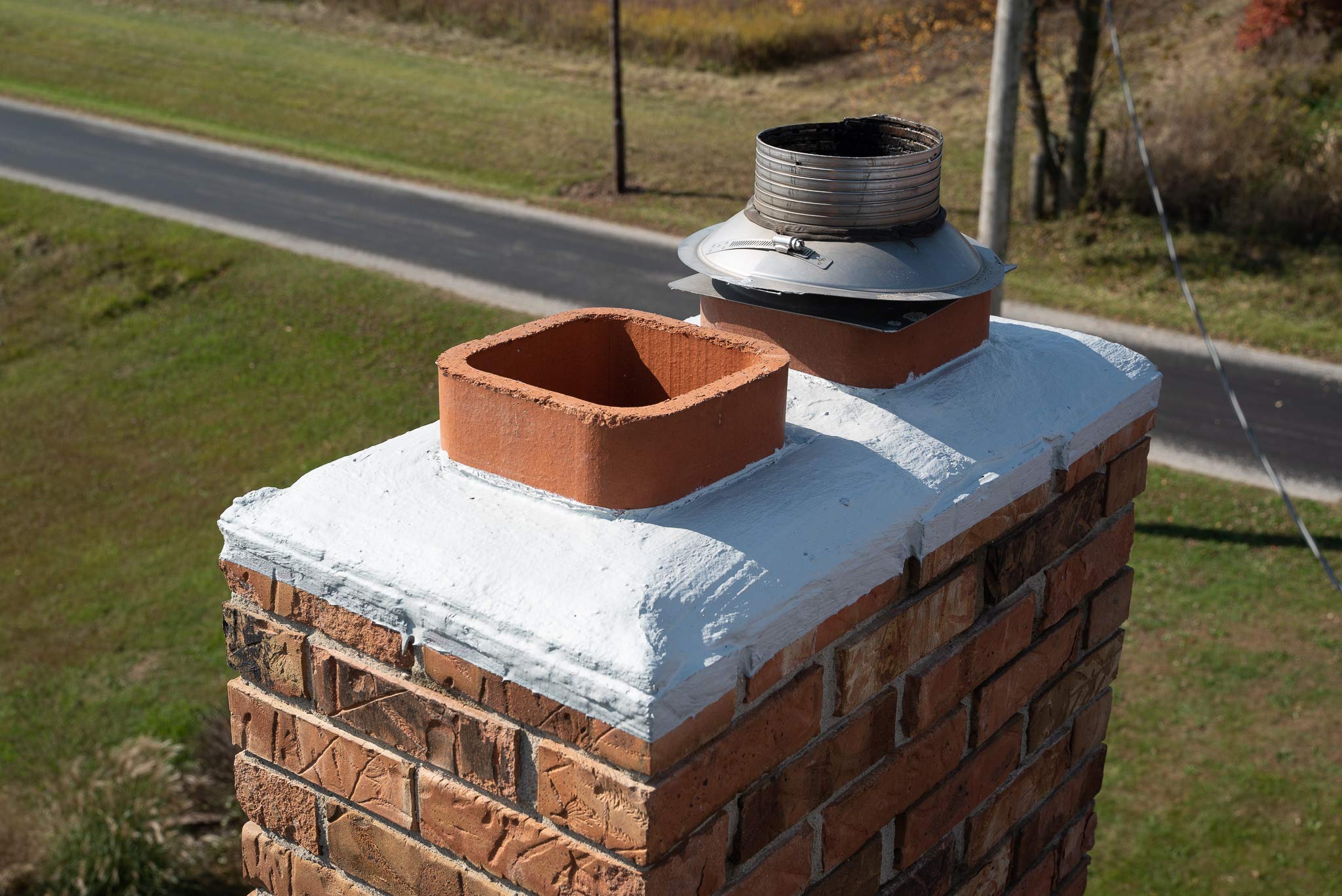 Chimney cap sealed with a silicone coating for waterproof protection. Prevents leaks, cracks, and weather damage for long-lasting durability.