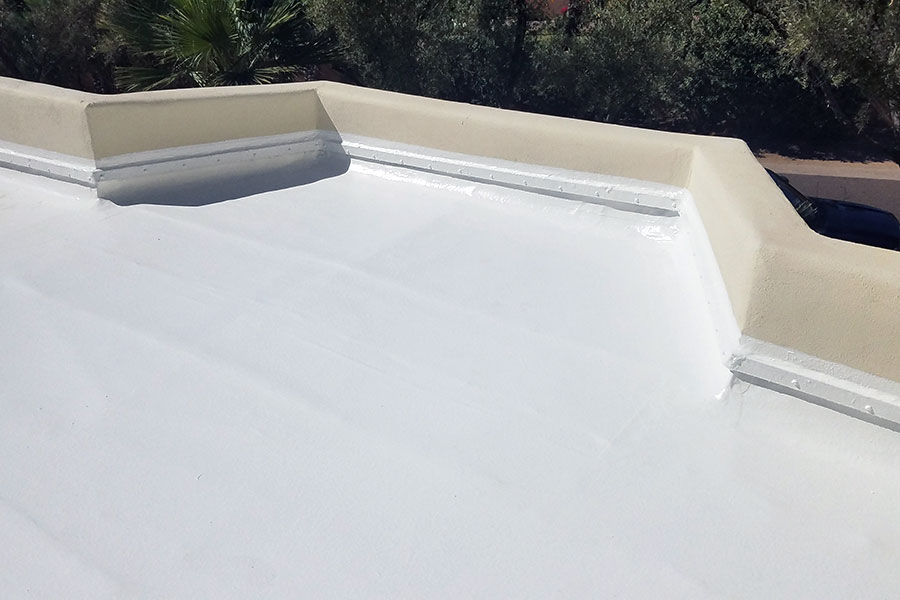 Silicone roof coating applied to a flat roof for waterproofing and UV protection. Long-lasting, energy-efficient roofing solution for Oklahoma homes and businesses.